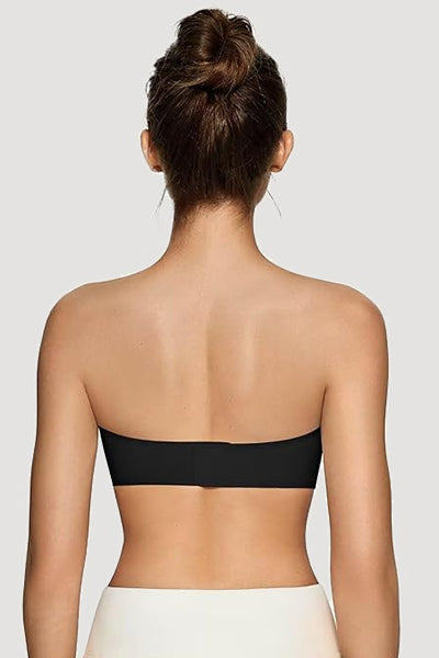A woman wearing a black vertvie strapless bra.