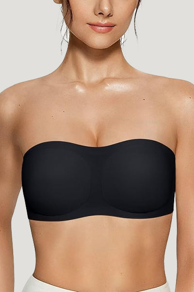 A woman wearing a black vertvie strapless bra.