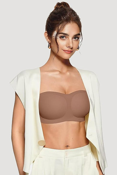 A woman wearing a vertvie coffee colored strapless bra.