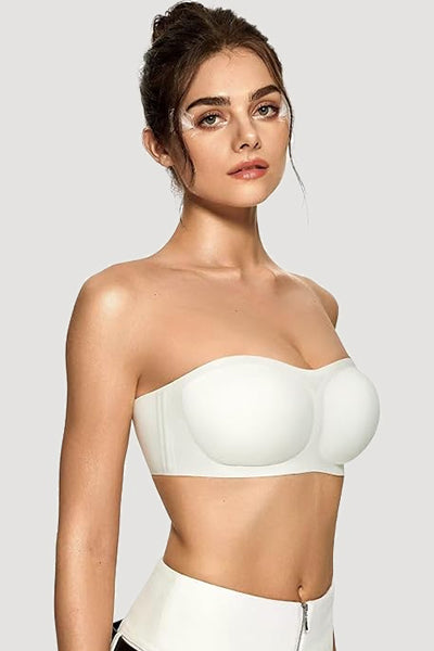 A woman wearing a white vertvie strapless bra.