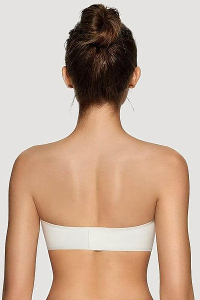 A woman wearing a white vertvie strapless bra.
