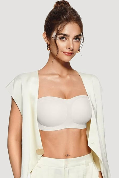 A woman wearing a white vertvie strapless bra.