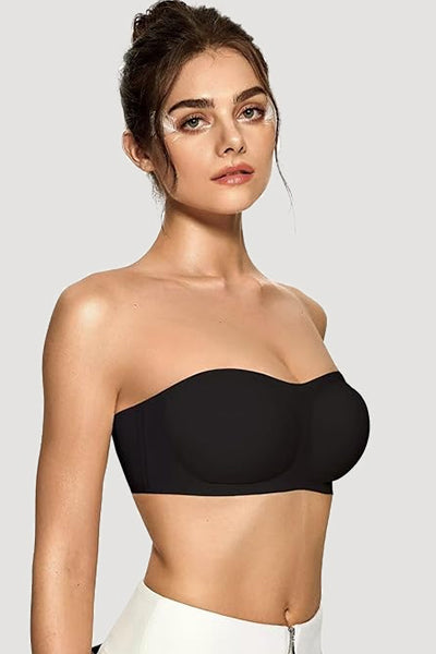 A woman wearing a black vertvie strapless bra.