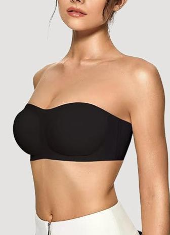 A woman wearing a black vertvie strapless bra.