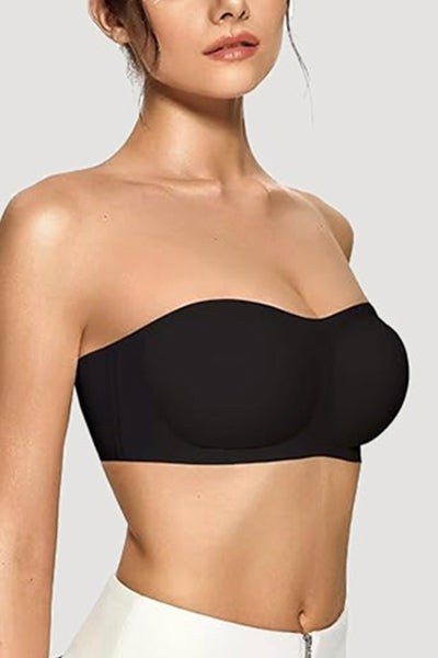 A woman wearing a black strapless bra.